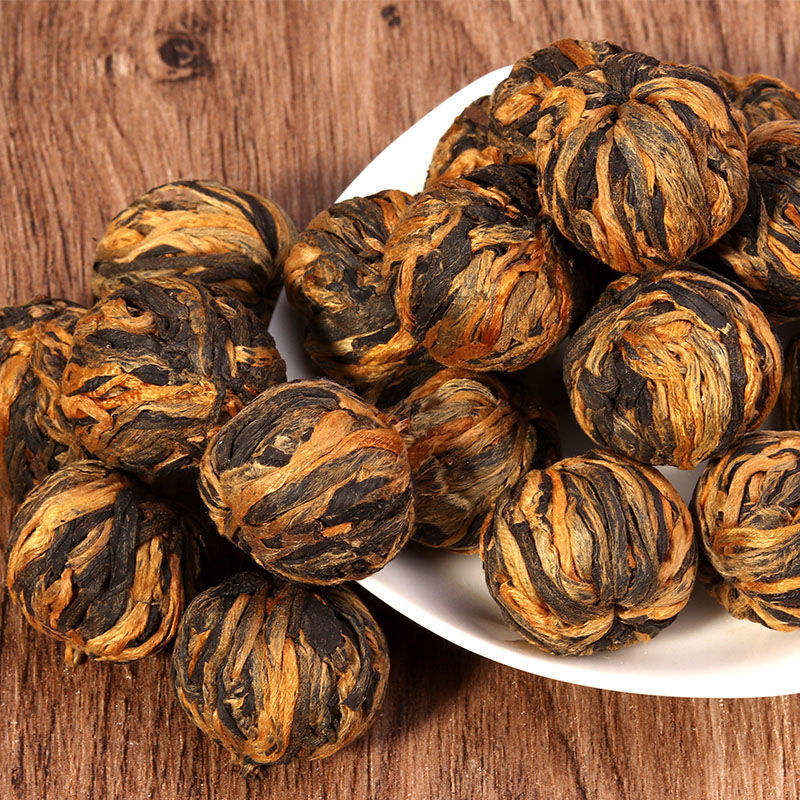 Bulk Hand‑Twisted Black Dragon Ball Black Tea | Yunnan Handmade Blooming Tea OEM ODM Private Label Supplier