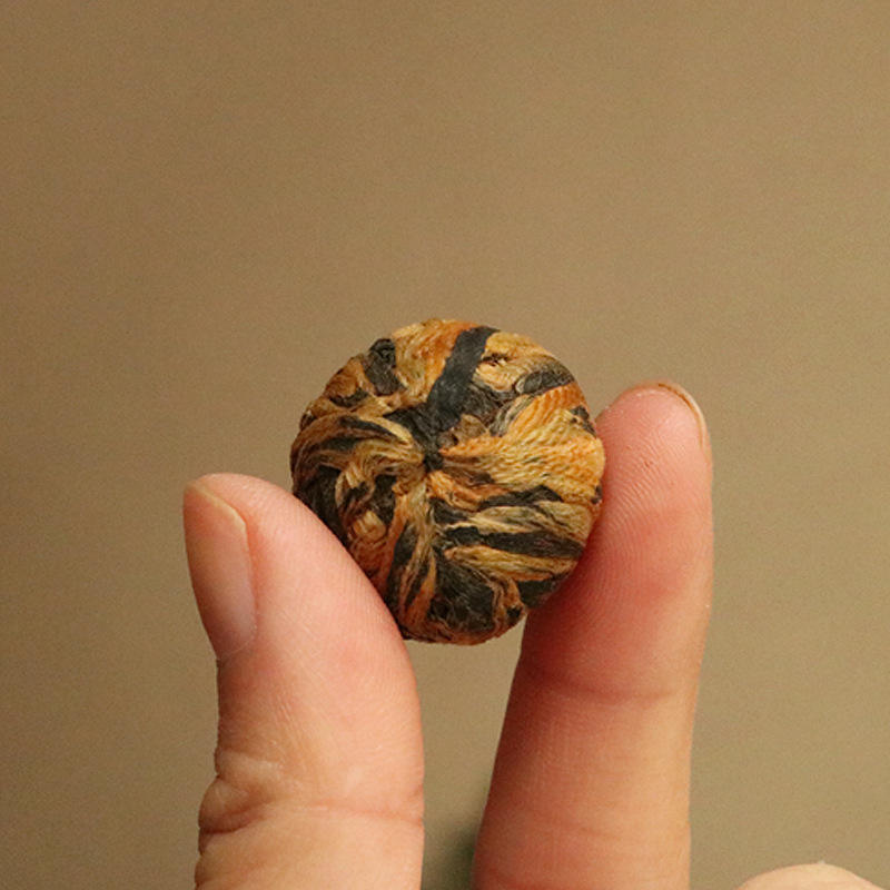 Bulk Hand‑Twisted Black Dragon Ball Black Tea | Yunnan Handmade Blooming Tea OEM ODM Private Label Supplier